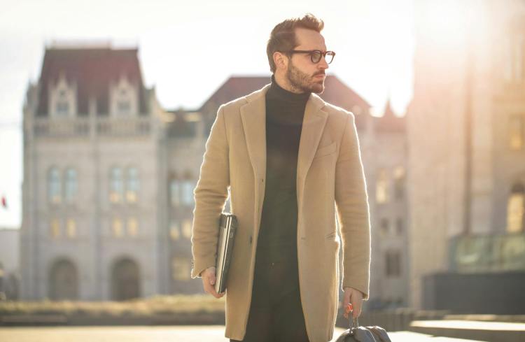 man wearing brown coat